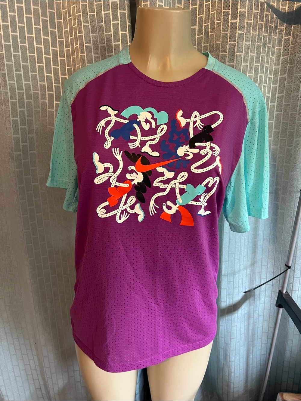 Nike Purple Tee with Teal Raglan Sleeves and Multicolor Graphic